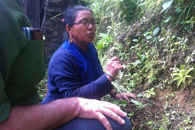 A woman in a high-hill village explaining the diversity of medicinal plants