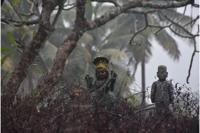 Abandoned statues found on the roof of the village temple, surrounded by withered leaves. These statues are a homage paid by the devotees in return for fulfilled wishes. The statue of a male child generally signifies a request for a male child from the devotees